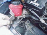 move power steering fluid tank